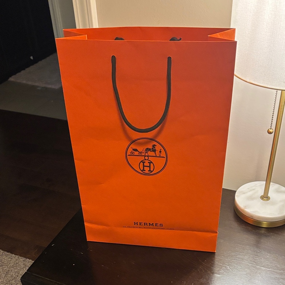 Hermès Signature Orange Bag with Black Handles
